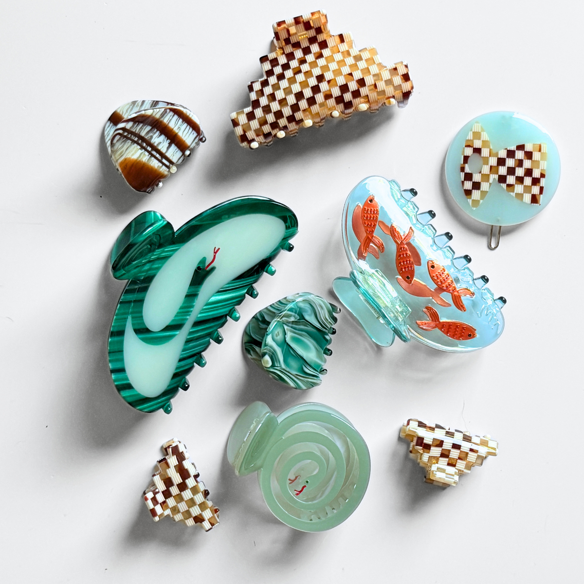 Set of fish-themed hair claws in clear and colored plastic with orange goldfish accents