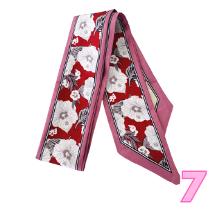 Women’s printed scarf with red and white floral silhouettes on pink and maroon border