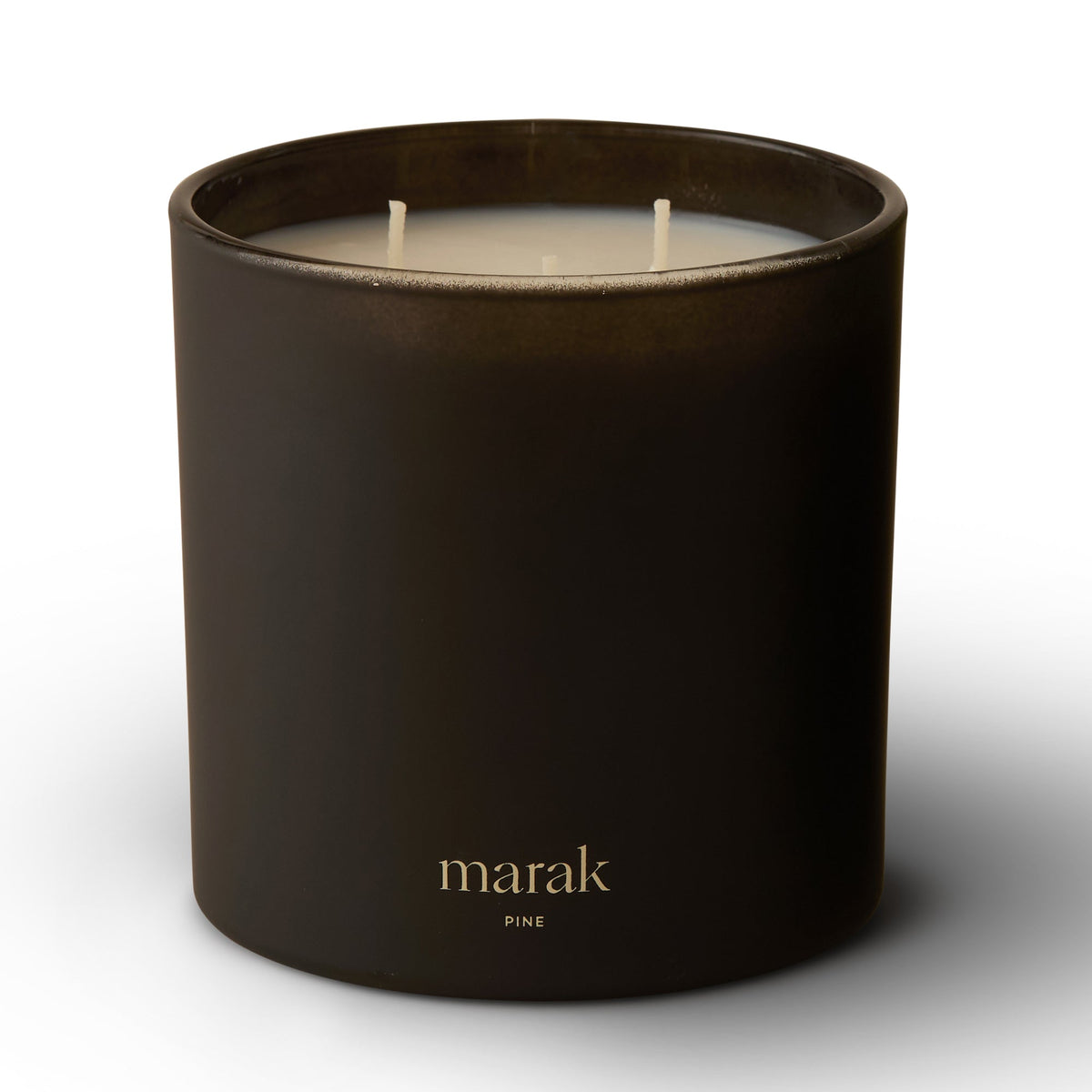 Dark scented candle jar with two white wicks and marak pine label