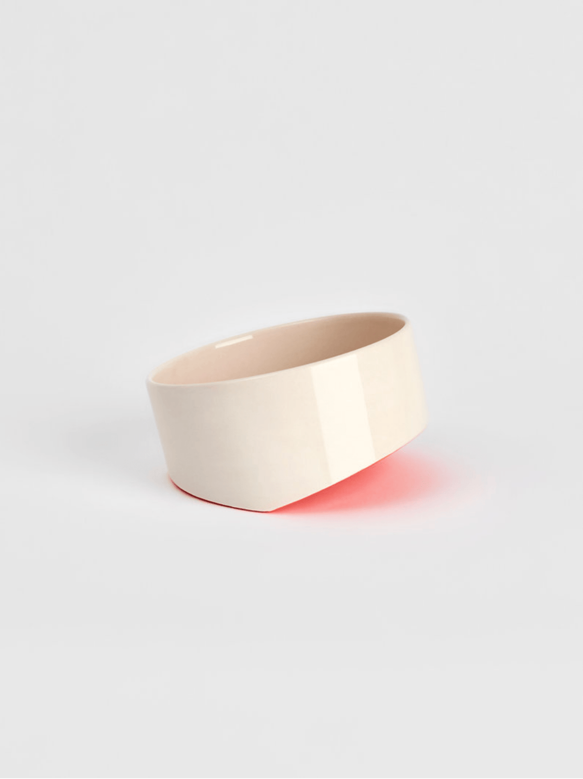 Ceramic cup in light cream with smooth sides and a wide open rim