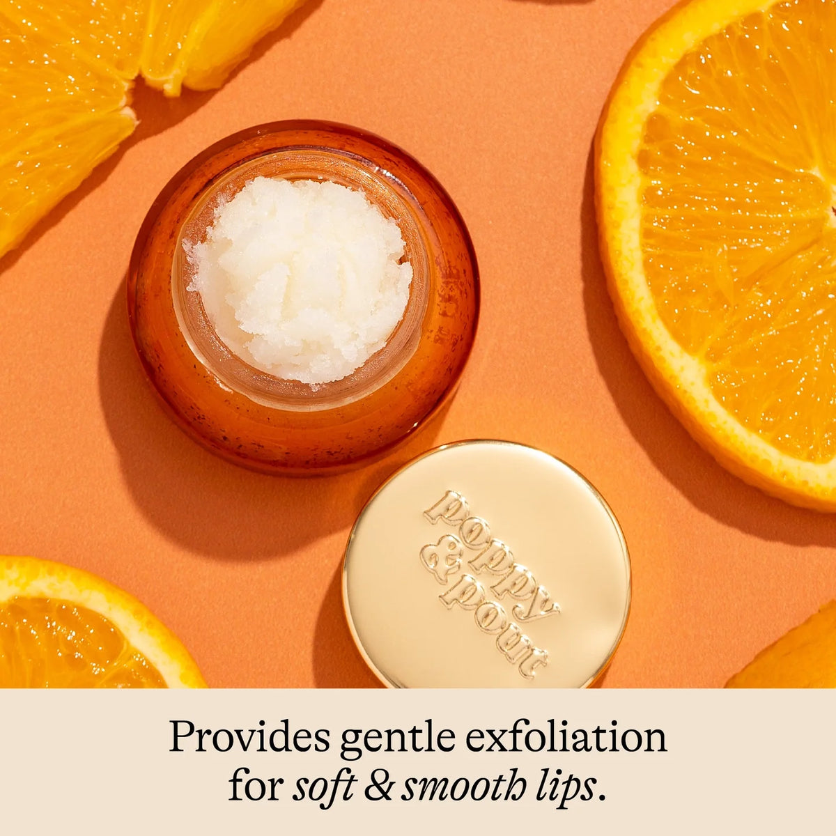 Orange blossom lip scrub in small jar with round lid and visible scrub texture