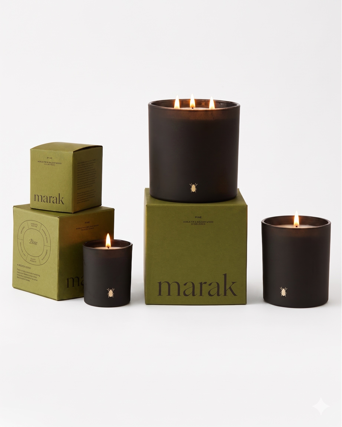 Black marak candle jar with small star emblem and three wicks with open flames