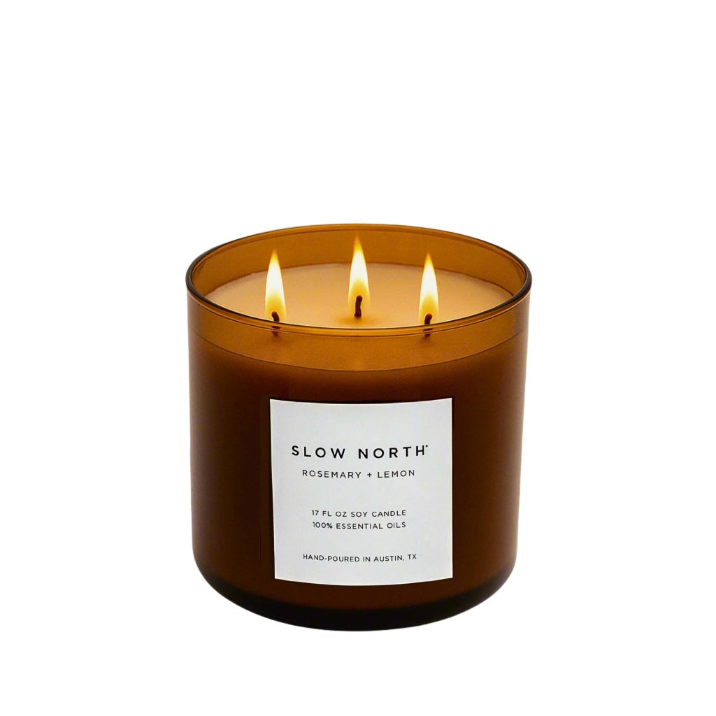 Brown 3-wick soy candle in glass jar with three wicks and front label