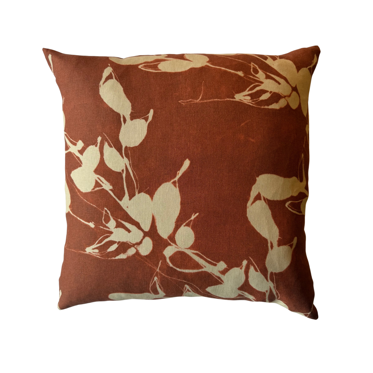 Clay brown throw pillow with beige floral botanical pattern, square front