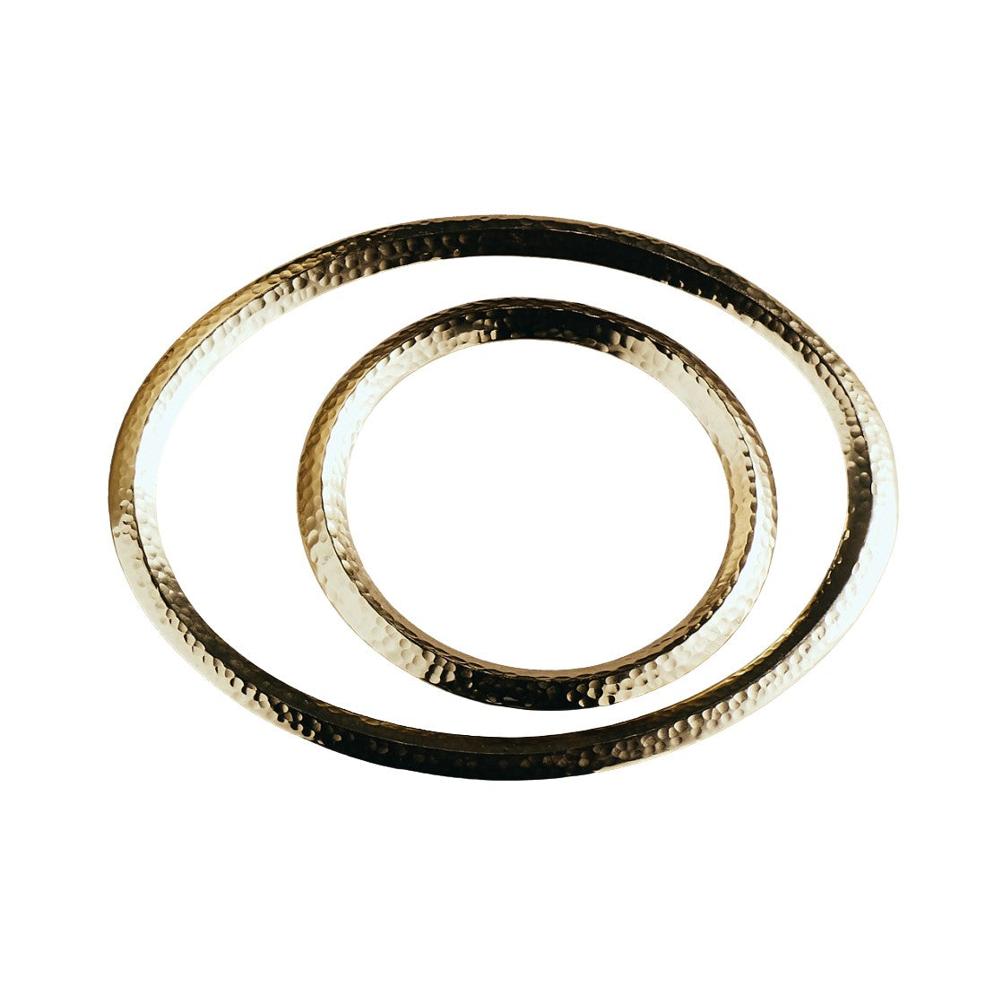 Nested pair of round trivets with hammered detailing and contrasting gold and dark rings.