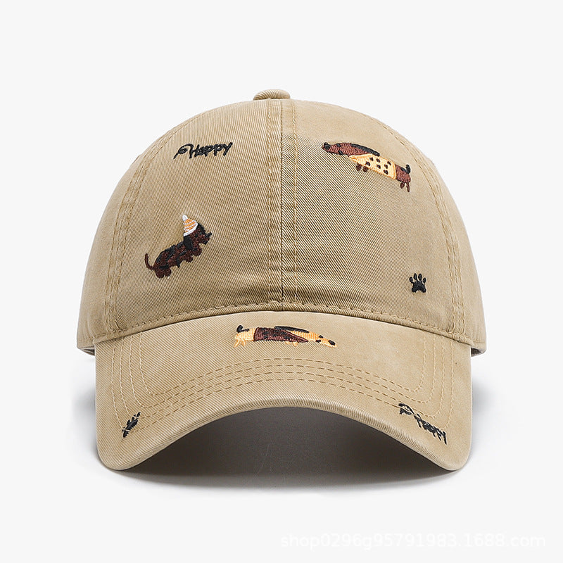 Khaki baseball cap with curved brim and embroidered animal motifs
