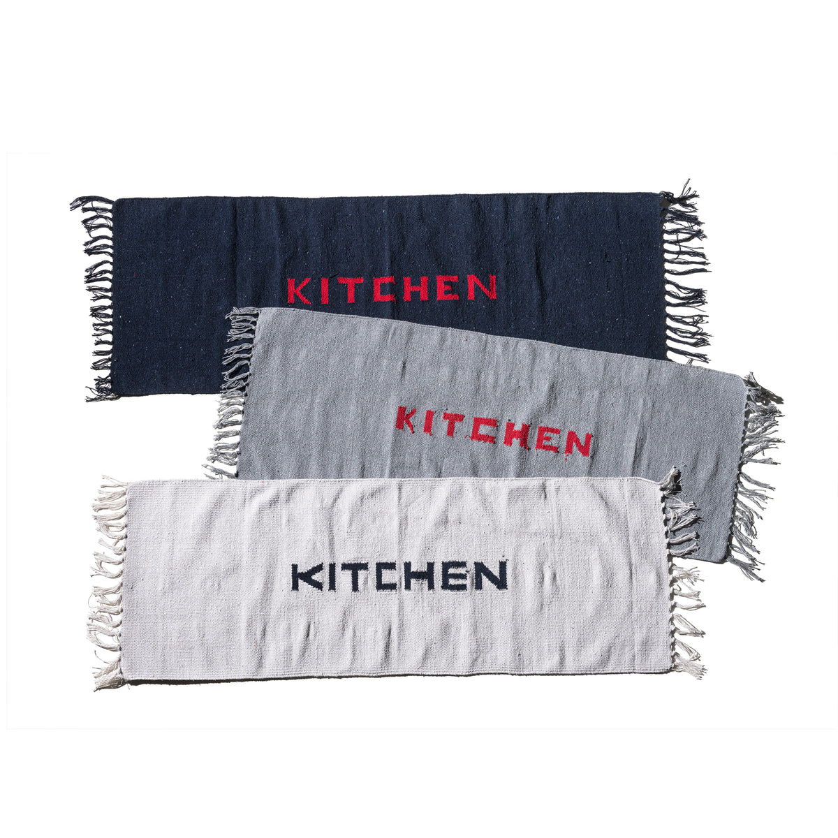 Navy blue kitchen mat with fringe edges and red 'KITCHEN' lettering