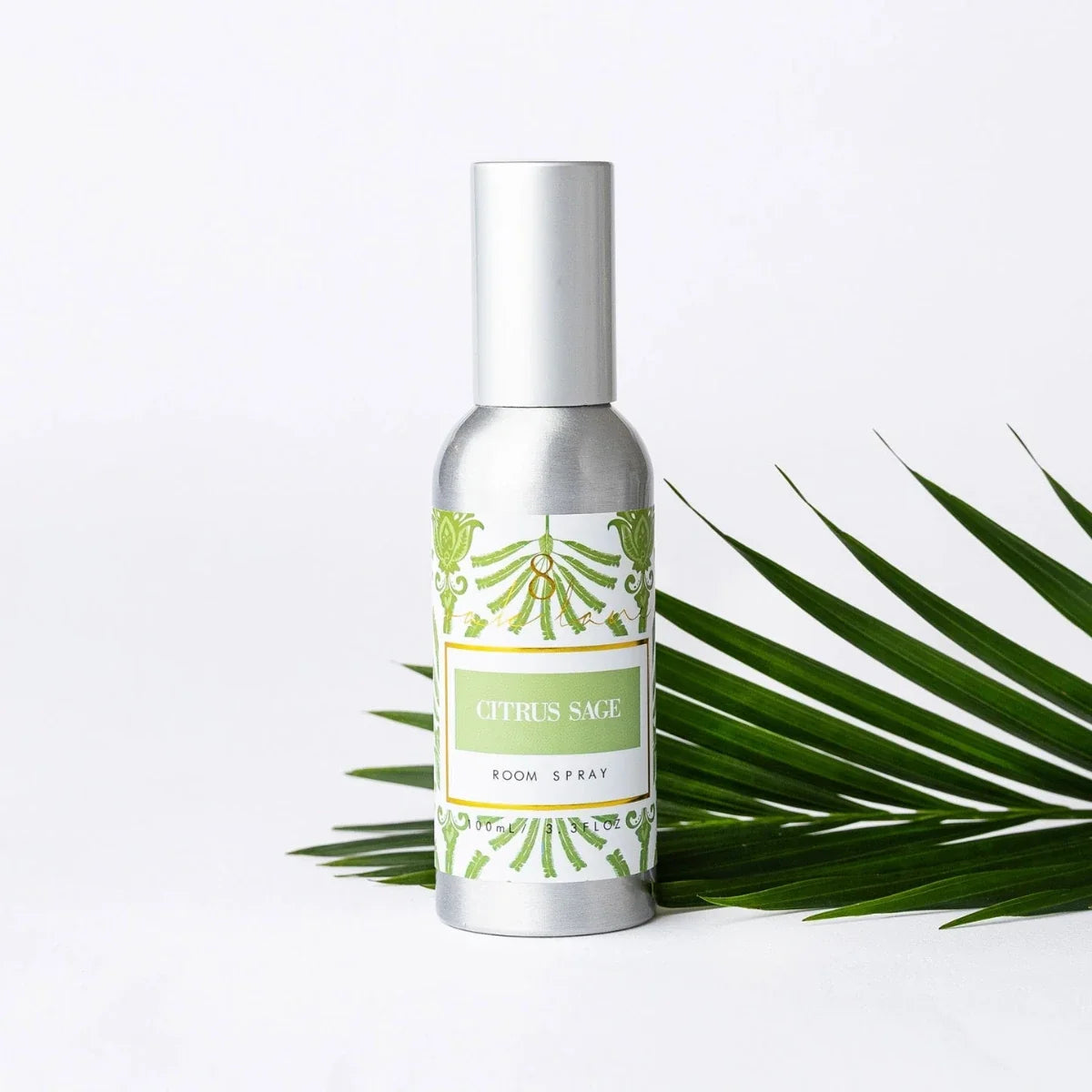 Room spray bottle with silver cap and "Citrus Sage" label