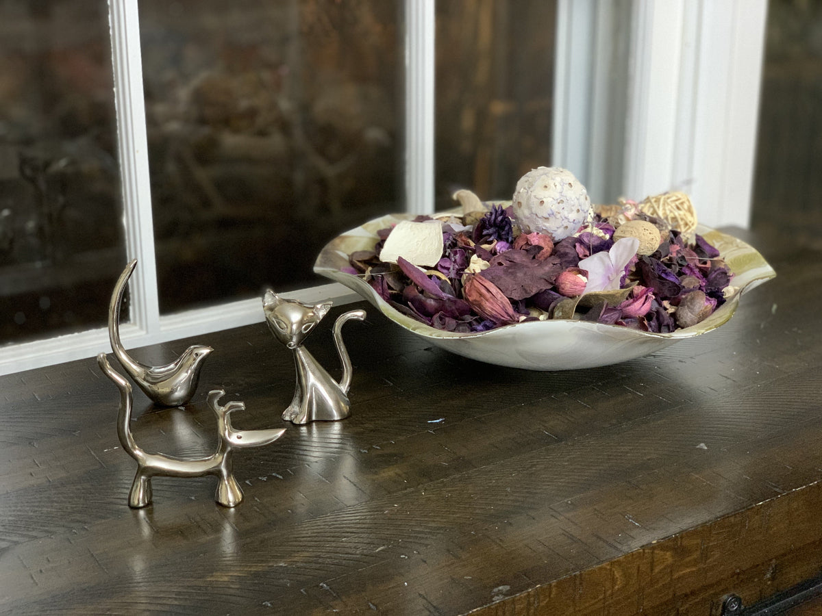 Silver animal ring holder set with three sculpted cat and dog figures, metallic finish