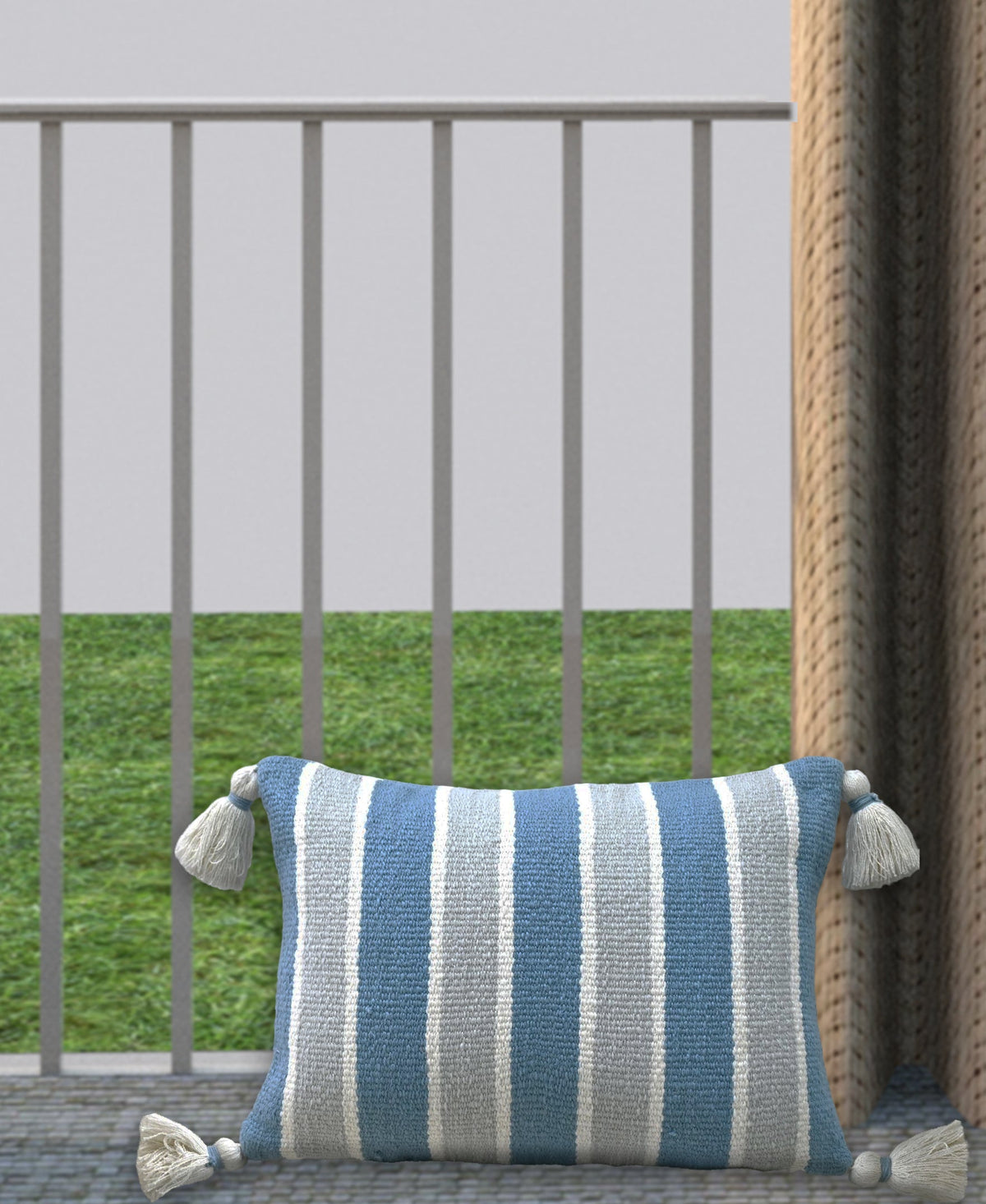 Blue and white striped decorative pillow with corner tassels