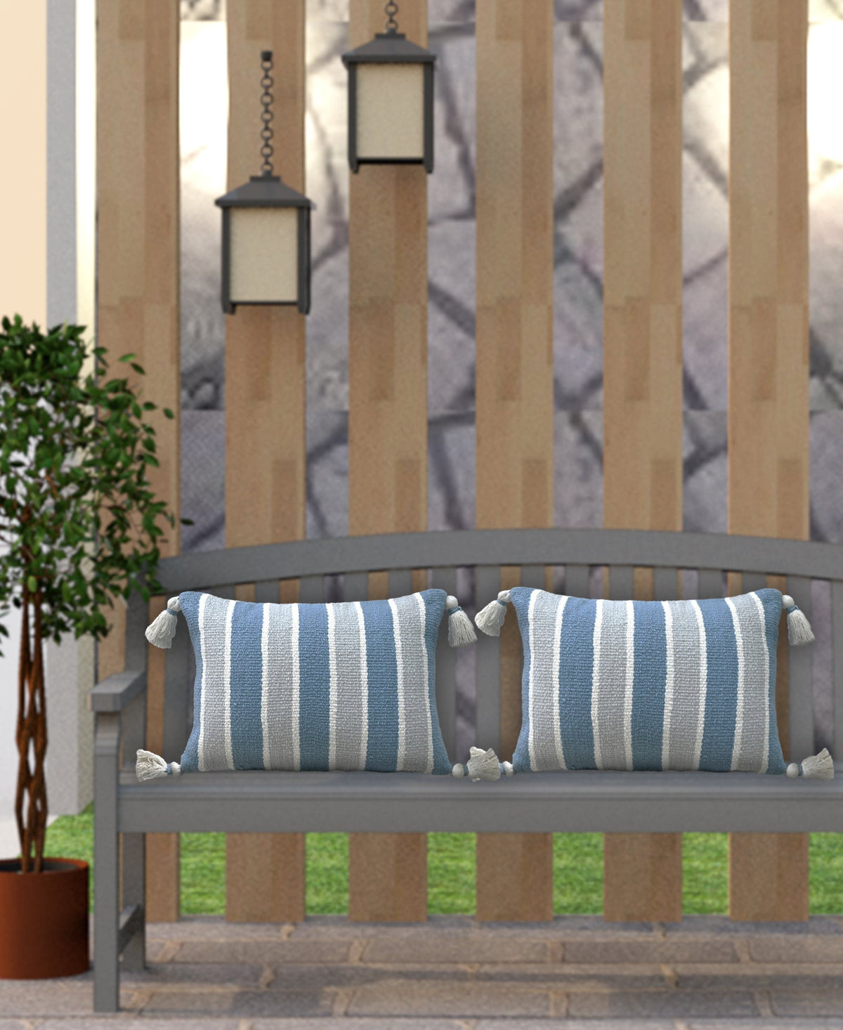 Set of blue and white striped decorative pillows with corner tassels