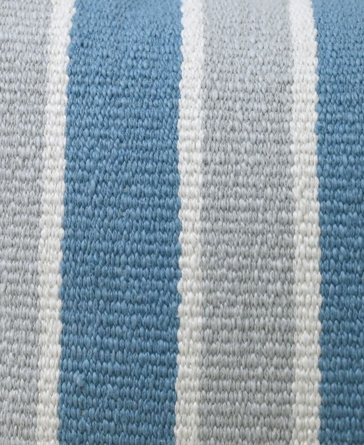 Woven blue and white striped pillow fabric, textured