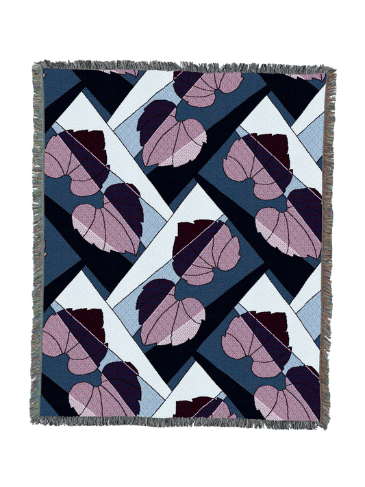 Leaf-pattern throw blanket with fringed border in navy, pale blue, and berry purple