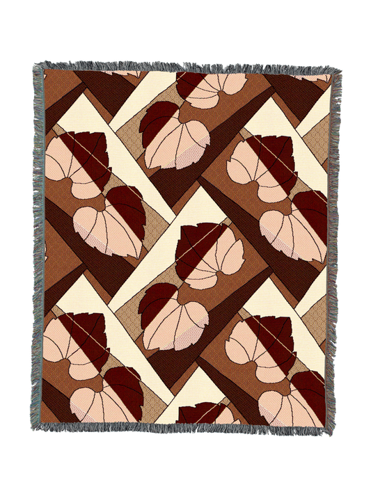 Leaf-pattern throw blanket with fringed border in rust and cream diamond blocks