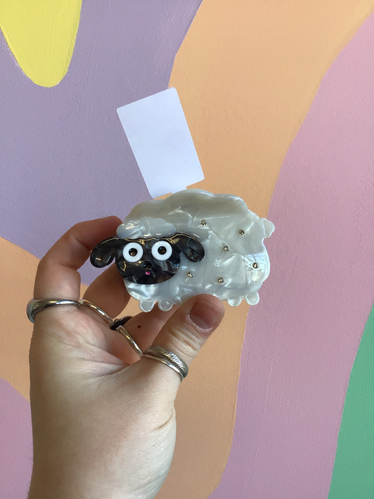 White sheep lamb hair claw with black curly hair and big cartoon eyes