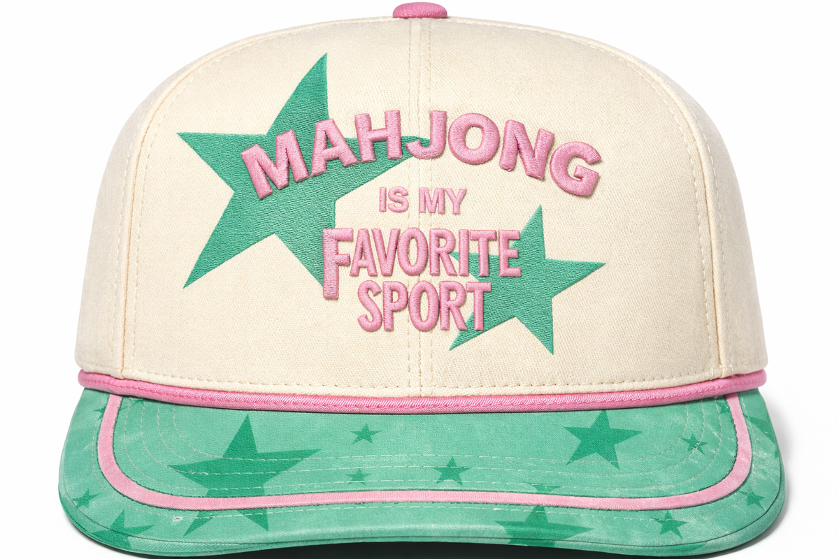 Cream baseball cap with large green star and pink "Favorite Sport" text over green brim.