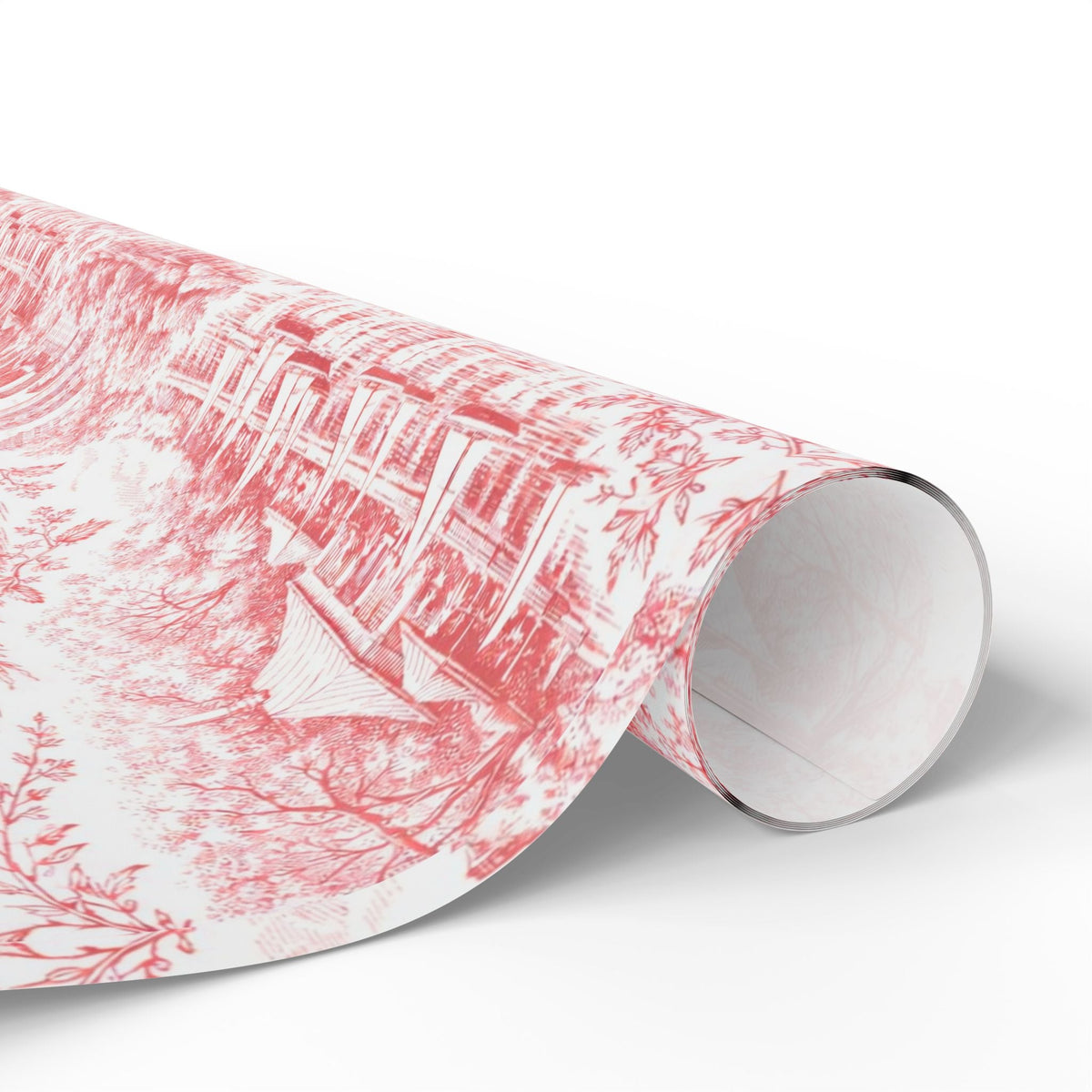 Red toile wrapping paper roll with city skyline pattern near cut edge