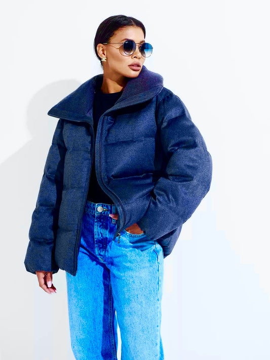 Navy puffer coat with wool-silk texture, wide collar, and front pockets
