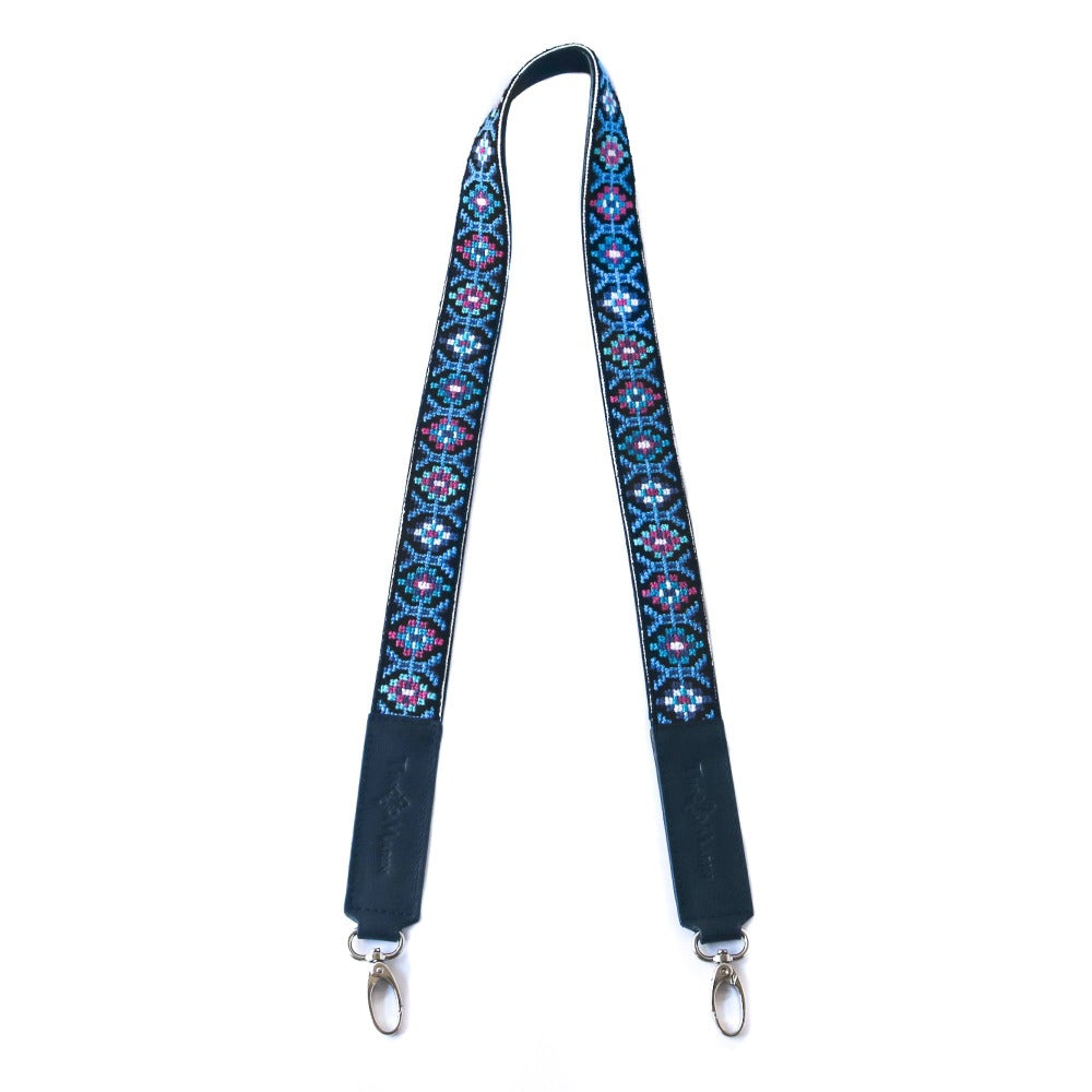Mai woven bag strap with dark base and blue/pink geometric pattern, metal clips