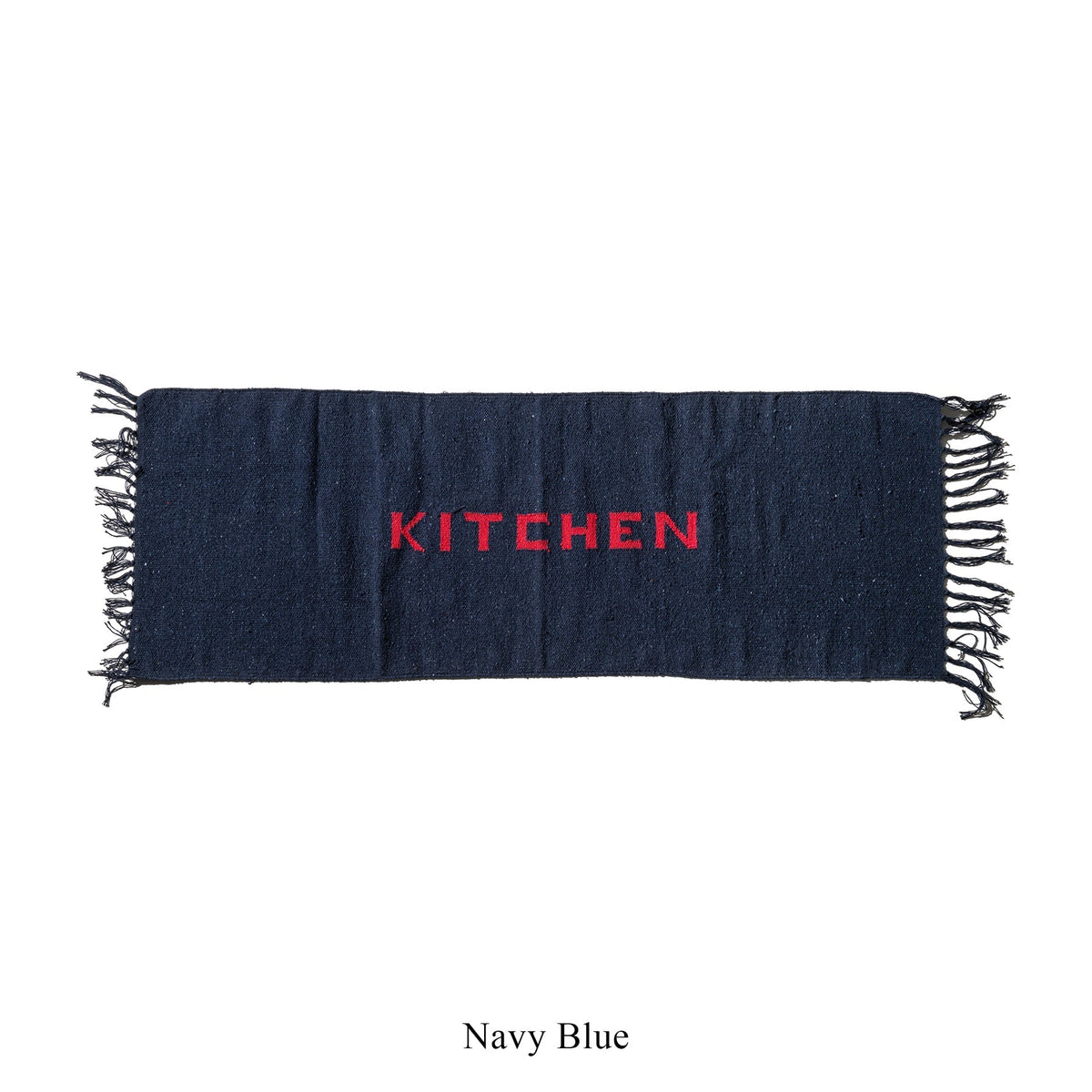 Navy blue kitchen mat with fringe edges and red 'KITCHEN' lettering