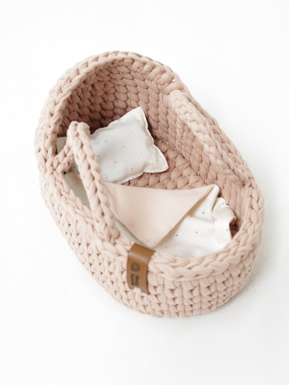 Beige knit mini doll moses basket with two fabric liners and small tag label