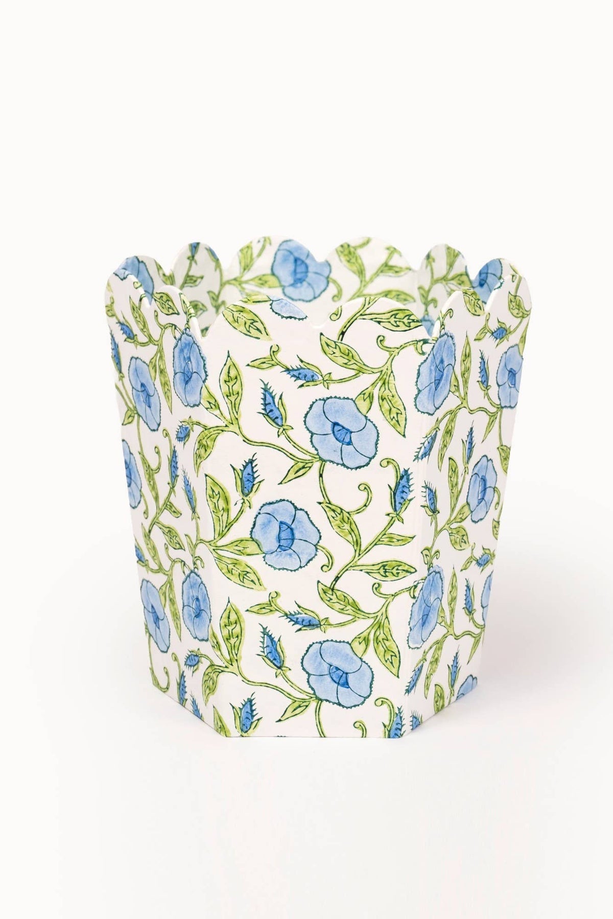 Collapsible fabric storage basket with blue and green botanical block print pattern.