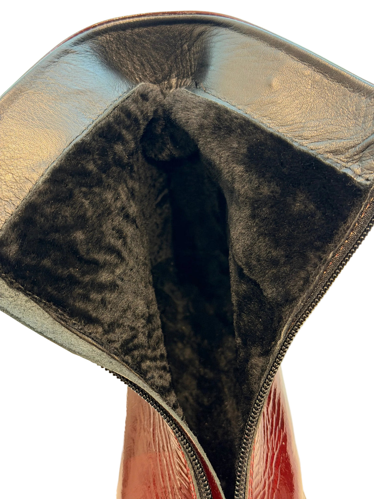 Close-up of the boot's soft dark lining inside the opened shaft