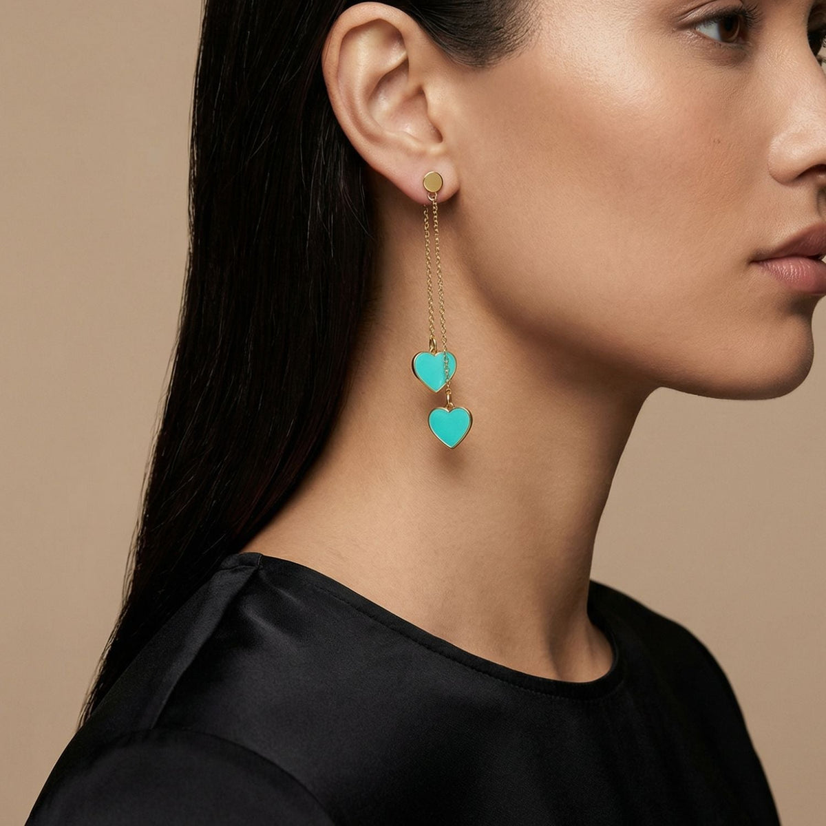 Gold-tone chain drop earrings with two turquoise heart charms and small hoop tops
