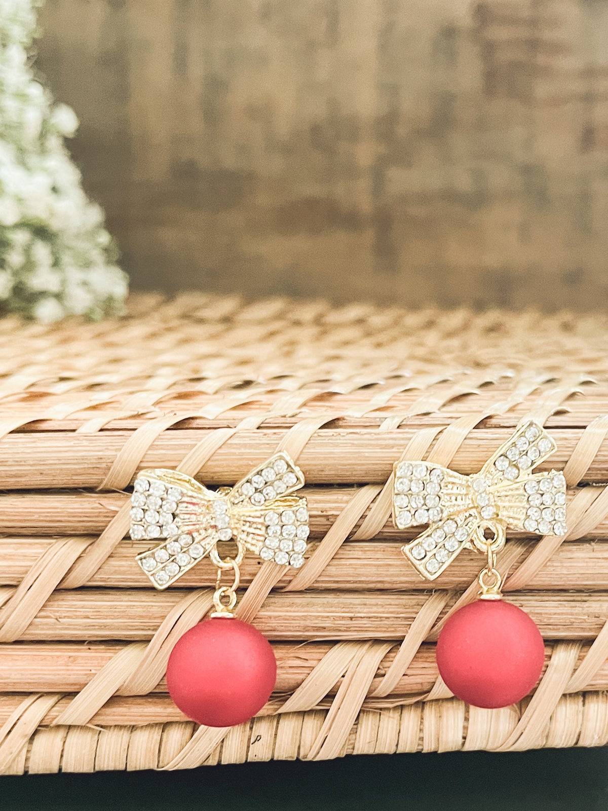 Gold bow Christmas bulb ornaments with red bead drops and rhinestone bow accents