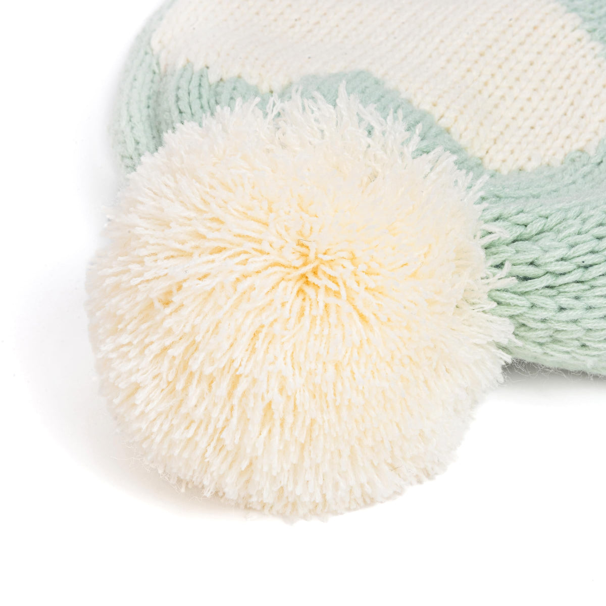 Mint green and white knit winter hat with fluffy white pom-pom