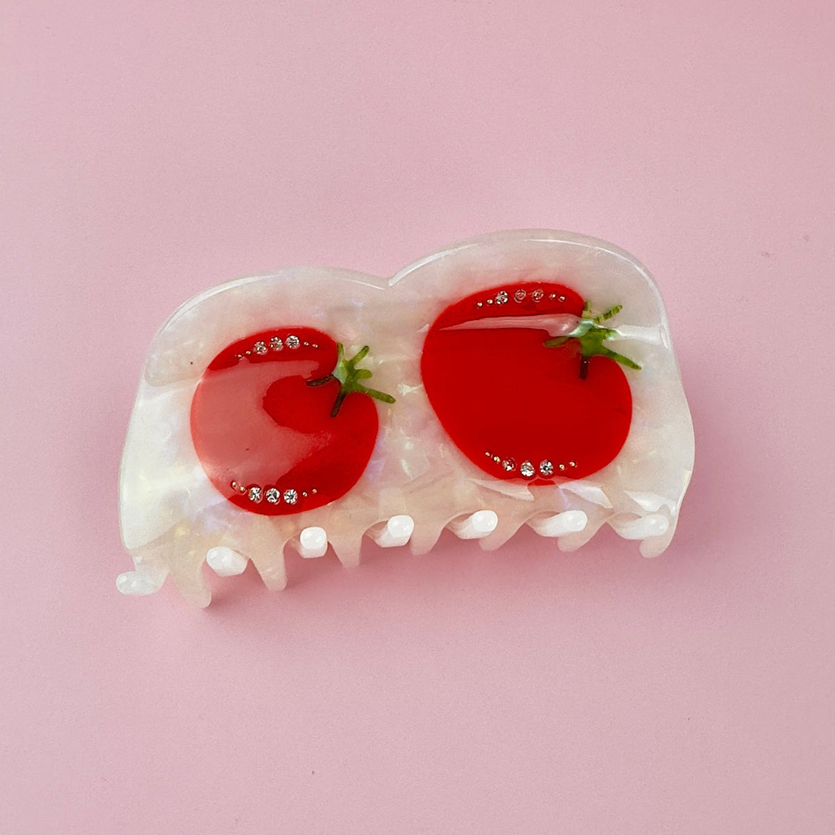 Tomato-themed hair claw clip with two red tomato slices and rhinestone dot accents