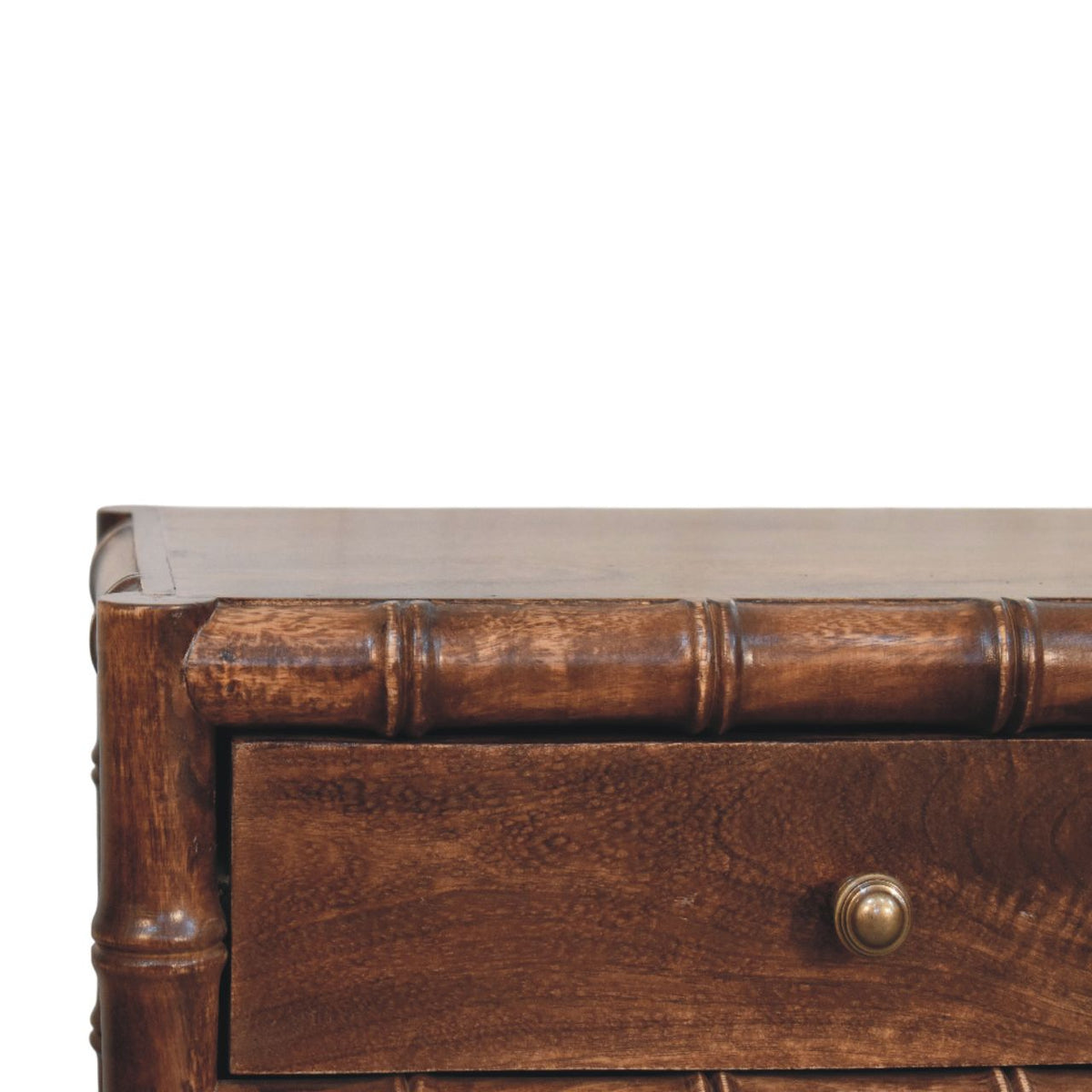 Brown wood nightstand drawer front with round metal knob and bamboo-style trim