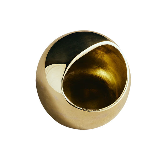 Gold salt cellar with round opening and dark interior lining