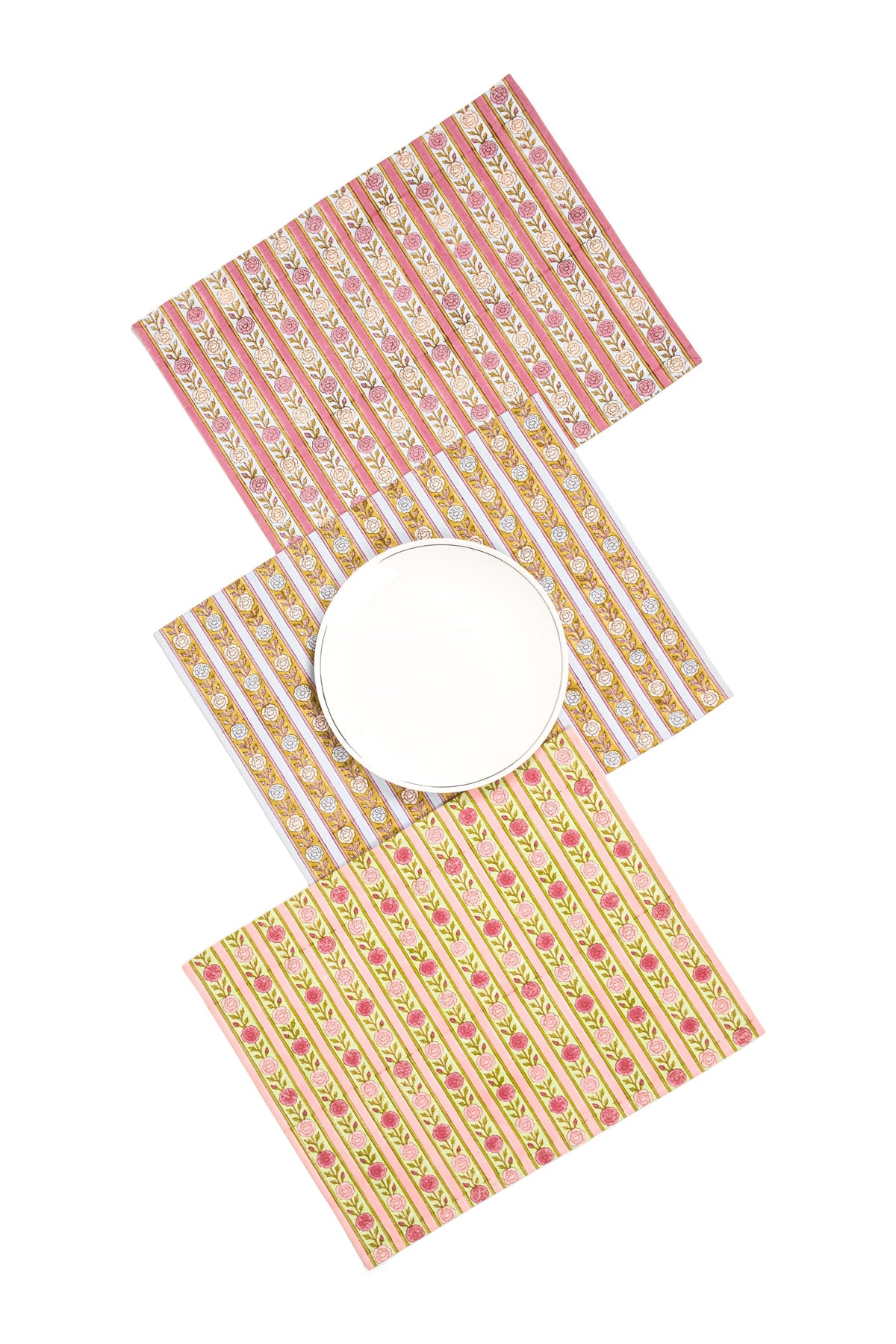 Pink floral striped placemats with two round plates on top