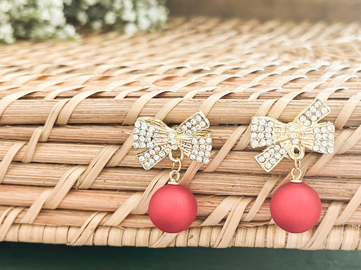 Gold bow Christmas bulb ornament pair with red bead dangles and sparkling rhinestone bows