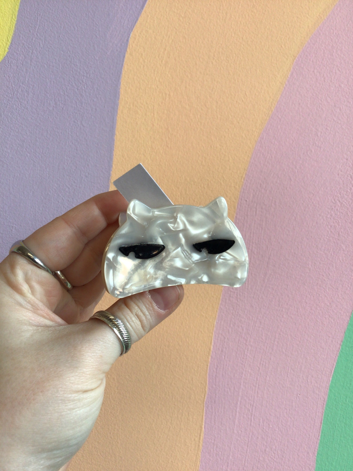 Cat-shaped hair claw, glossy silver with black stripe detailing