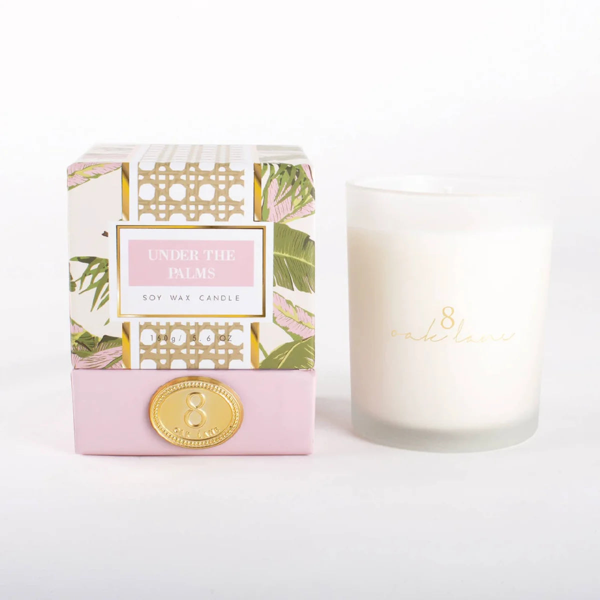 Boxed soy wax candle with white glass jar and decorative tropical palm label