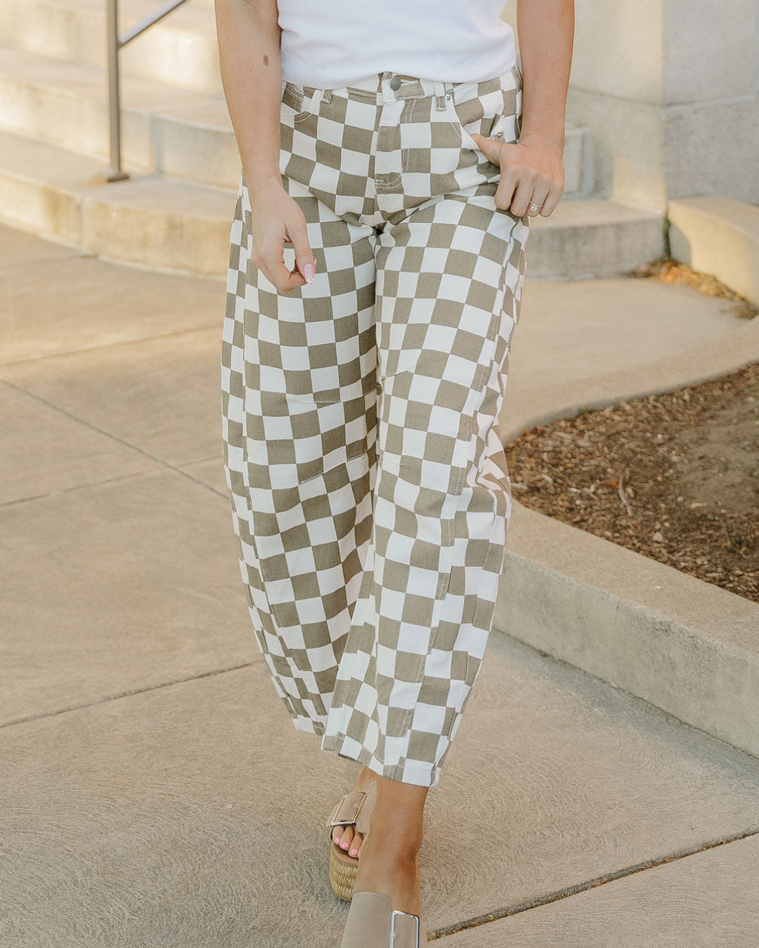 Sage green and off-white checkered denim barrel pants with tapered ankle cuffs