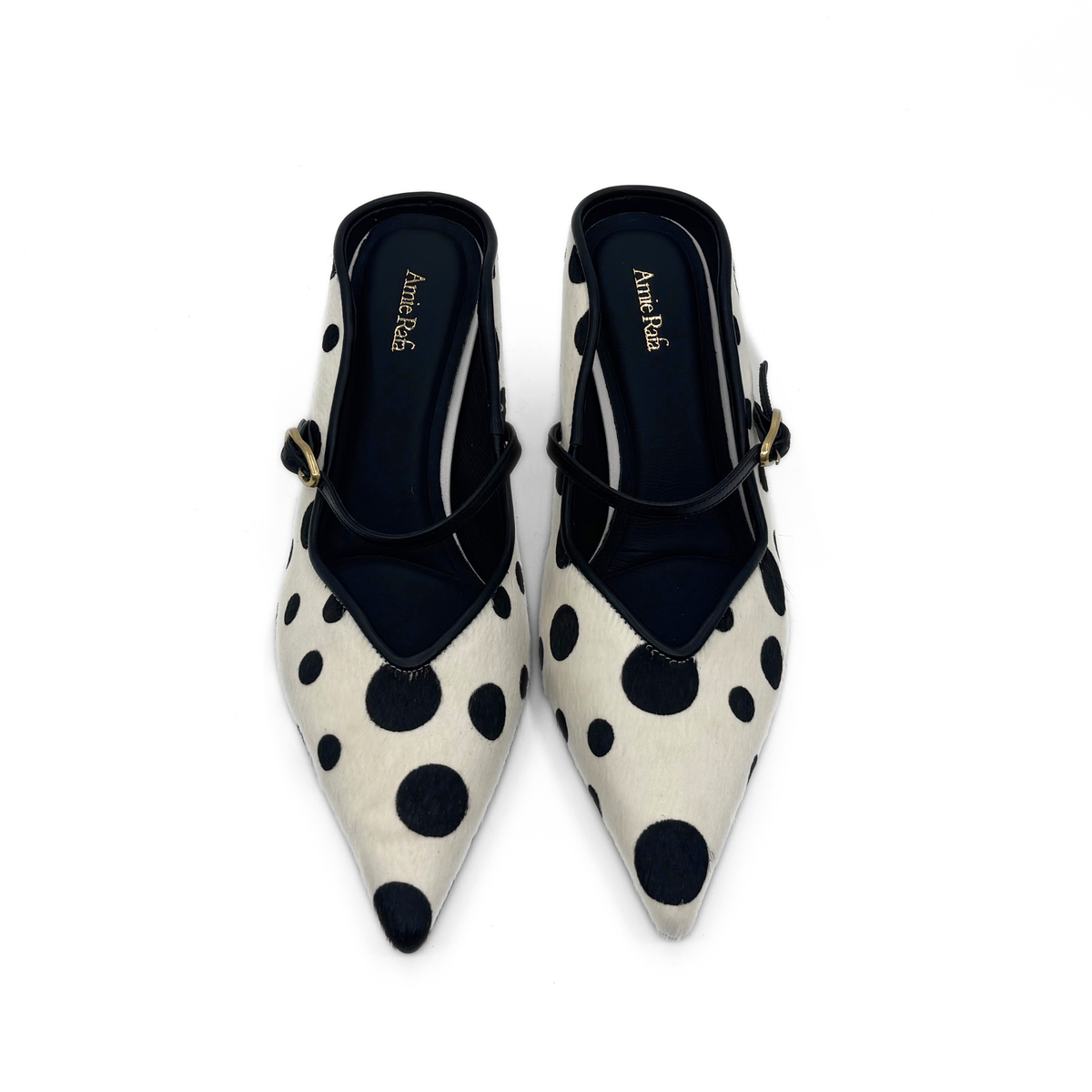 Nicky Pony Hair pumps in cream with large black dots; closed toe with ankle strap.