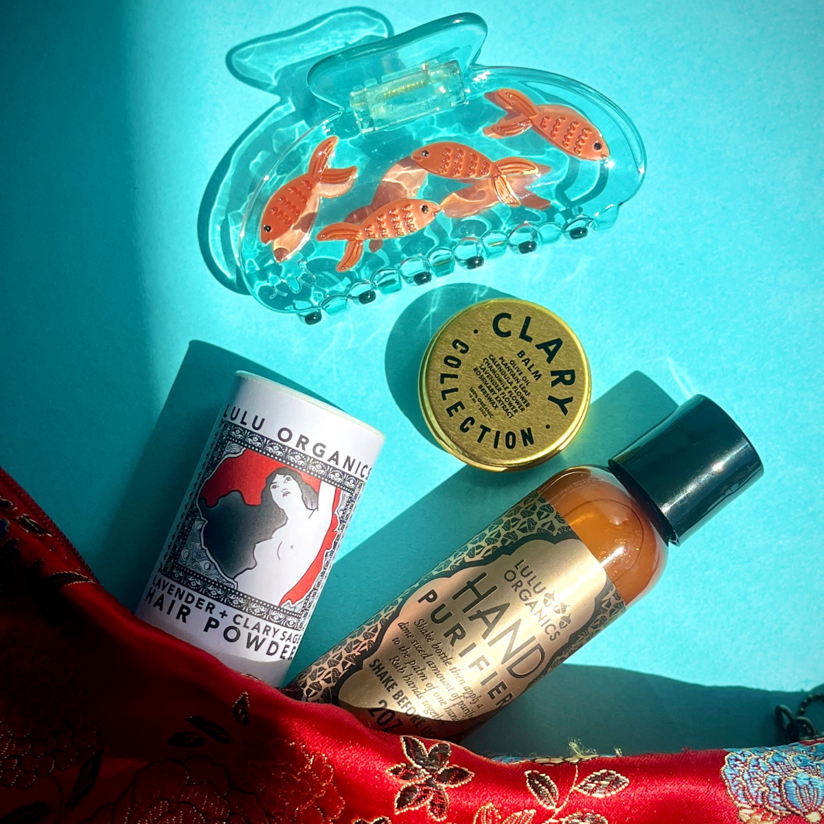 Fish-themed hair claw with orange goldfish inside clear blue resin