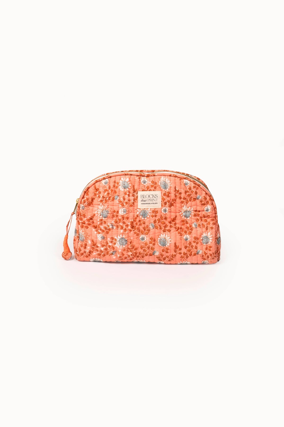 Terracotta quilted block-print travel pouch with zipper and drawstring cord