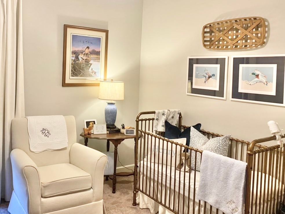 Living room nursery-style display with framed mallard duck flight prints on wall