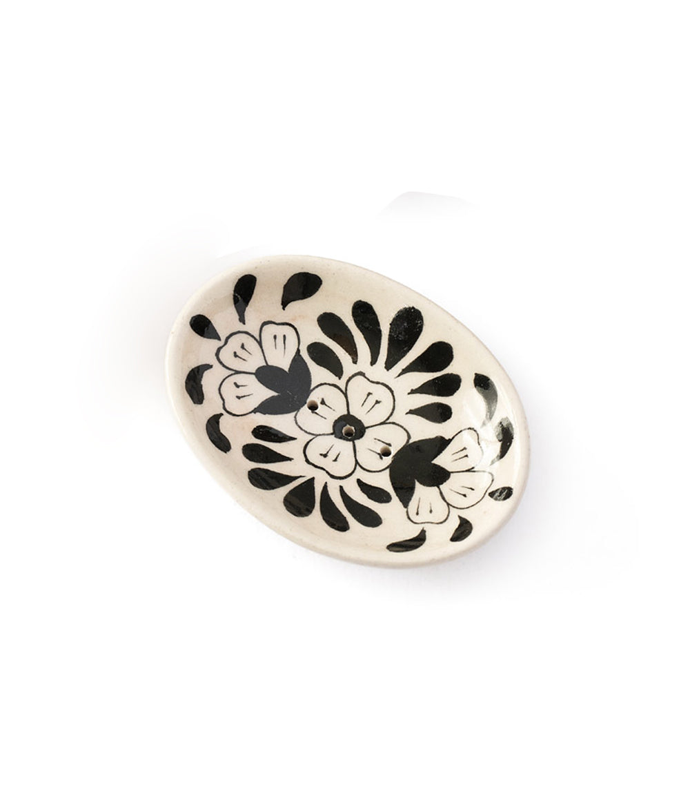Oval cream ceramic soap dish with hand-painted black flowers and small dot accents