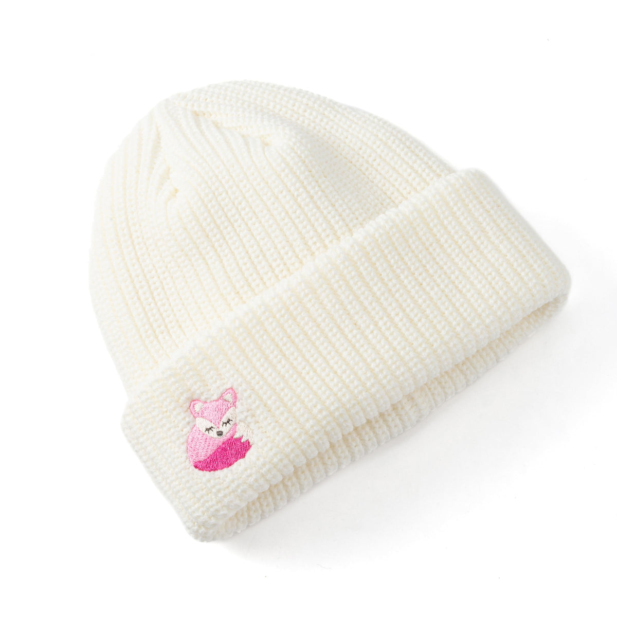 White rib-knit beanie with a pink fox patch on the folded cuff