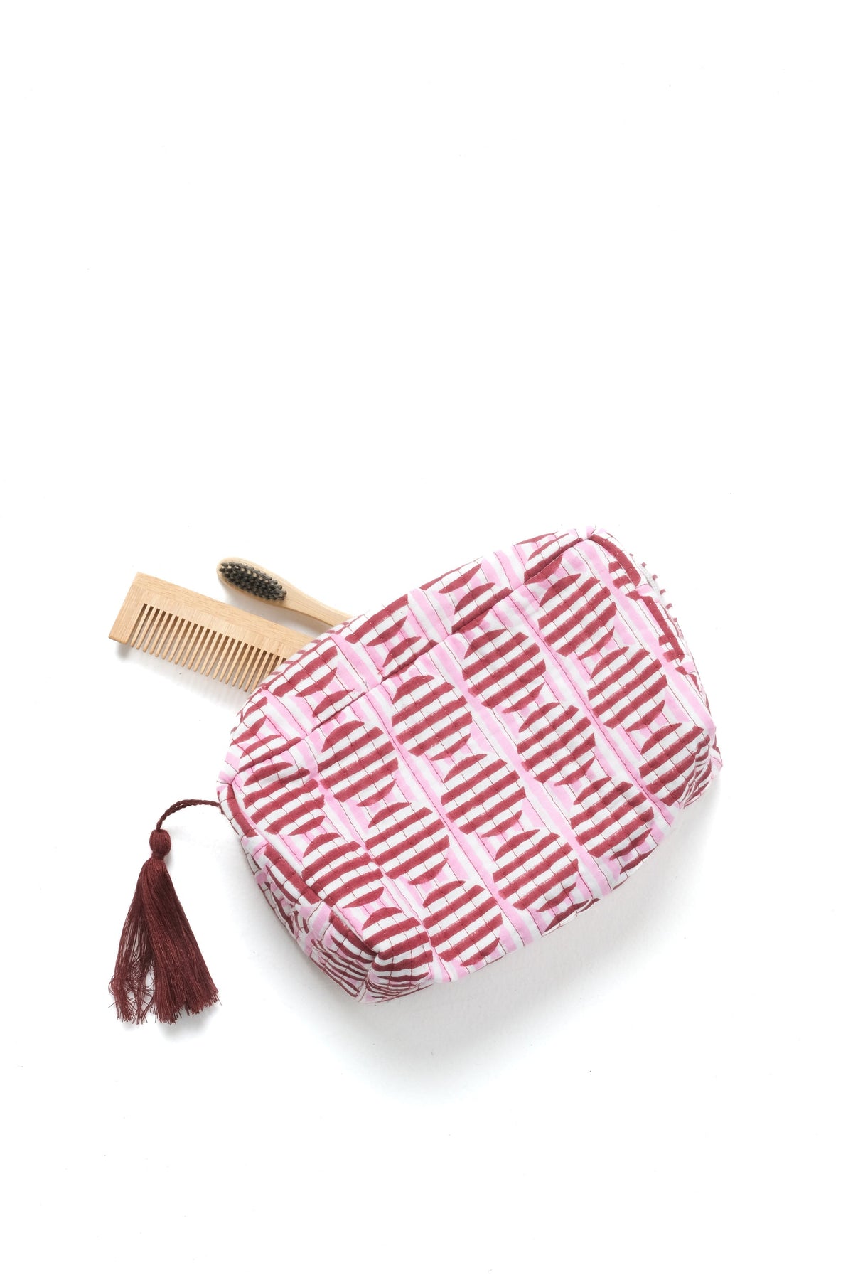 Burgundy and pink striped blockprint zip makeup pouch with brown tassel pull