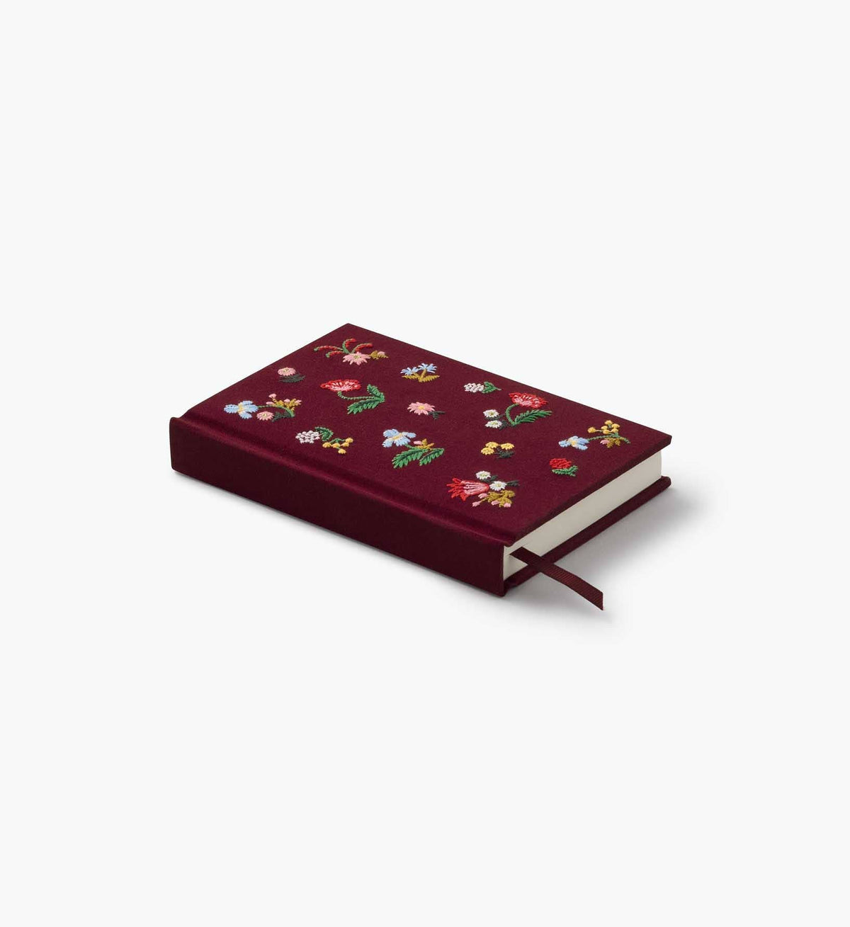 Mini embroidered journal with burgundy embroidered cover and tied ribbon closure