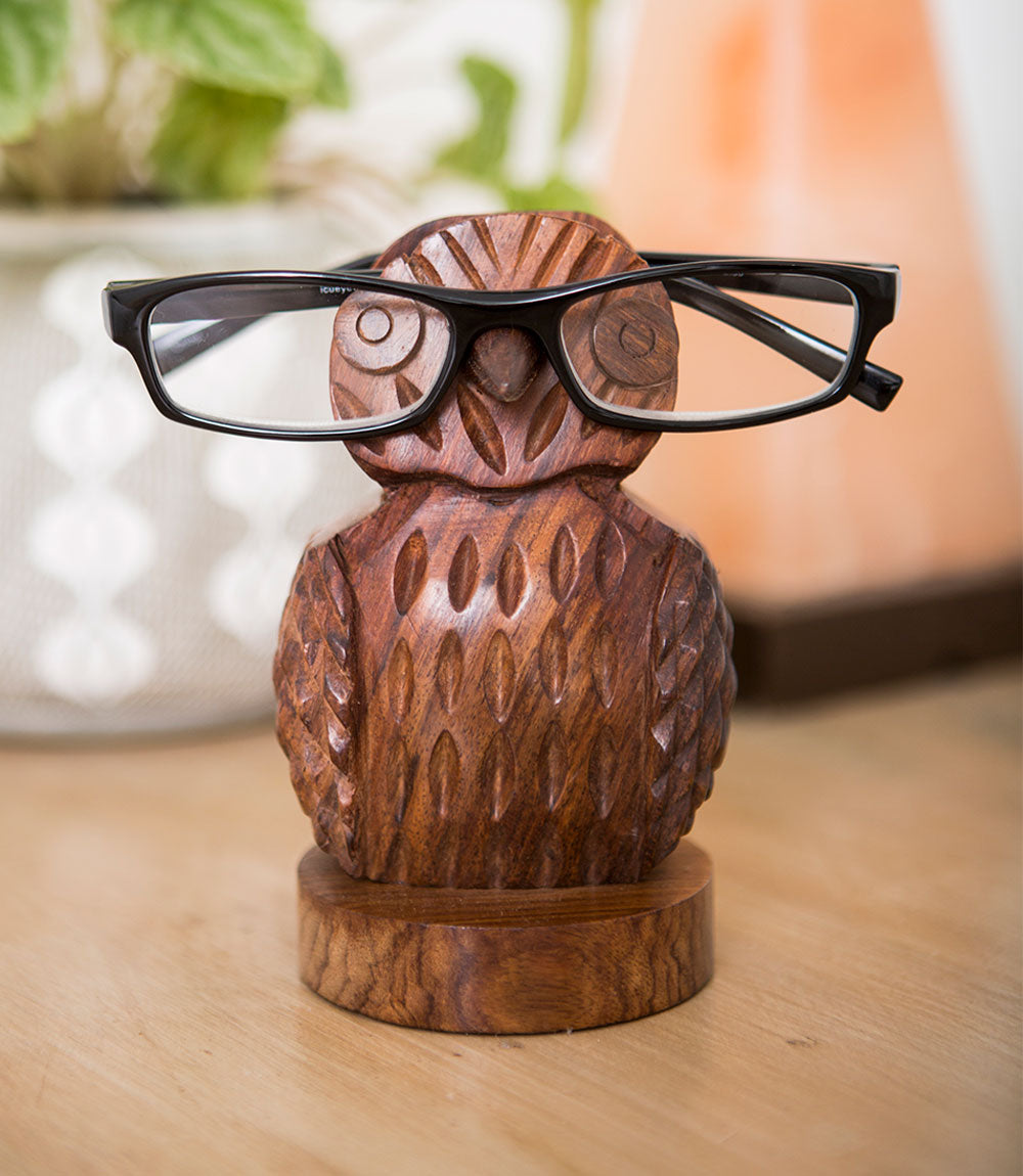 Hand-carved wooden owl eyeglass holder stand, front view with carved wing details