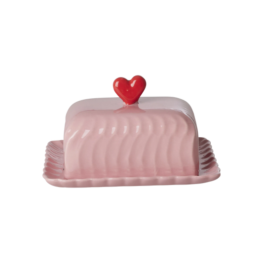 Pink ceramic butter dish lid with red heart knob and scalloped base edges