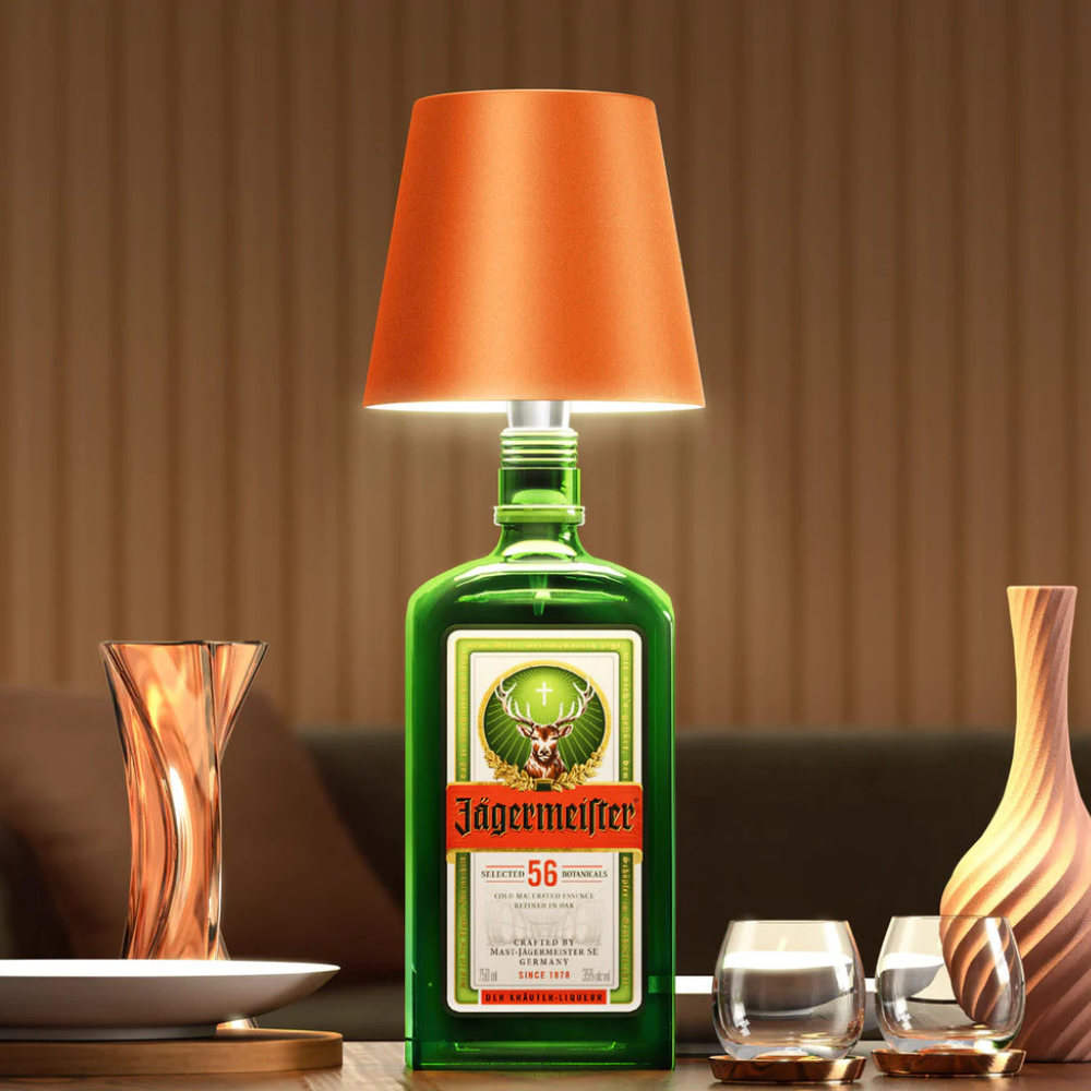 Wireless bottle lamp with orange fabric shade and green bottle base