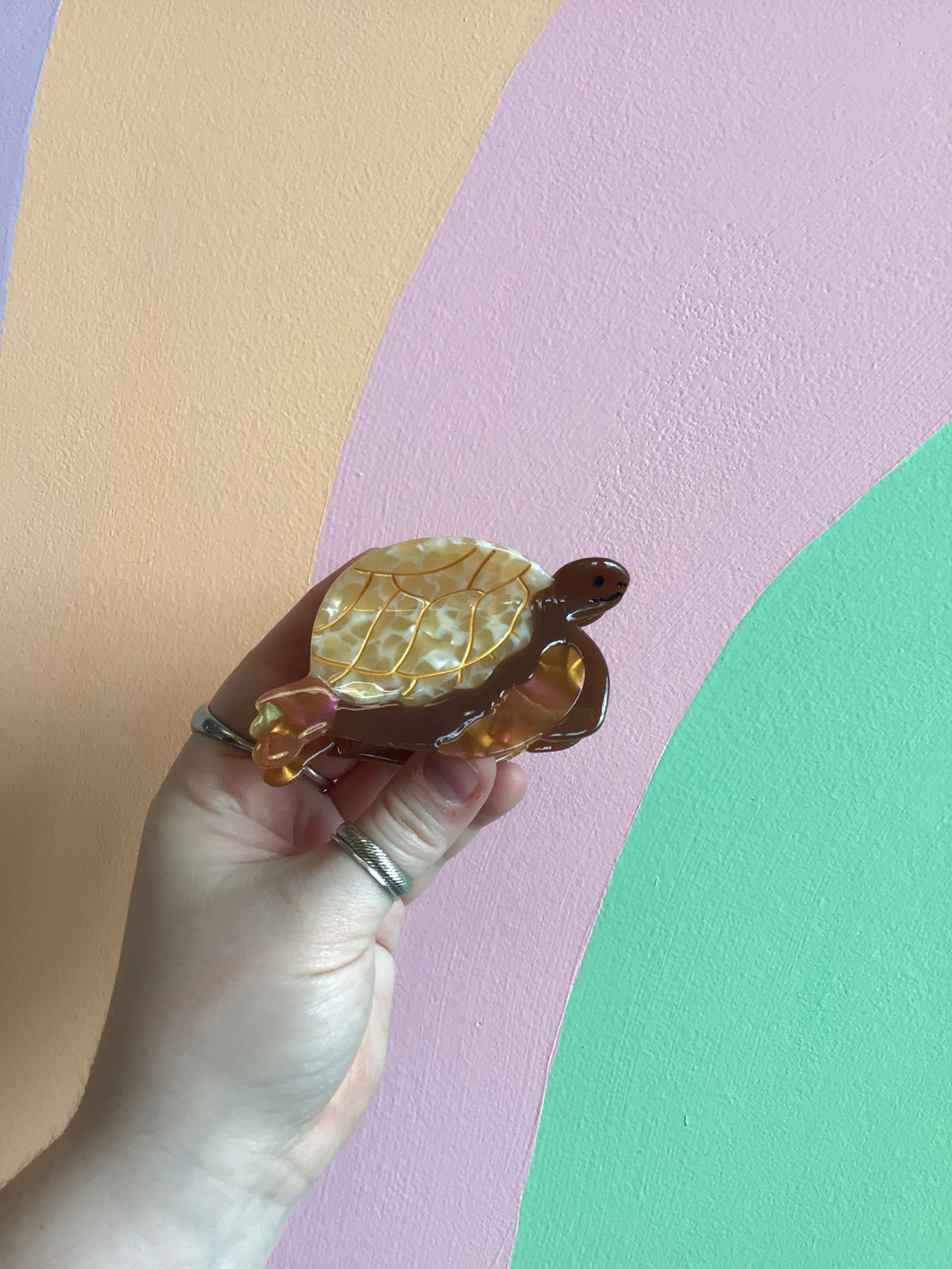 Sea turtle hair claw with amber gold shell and warm brown flippers
